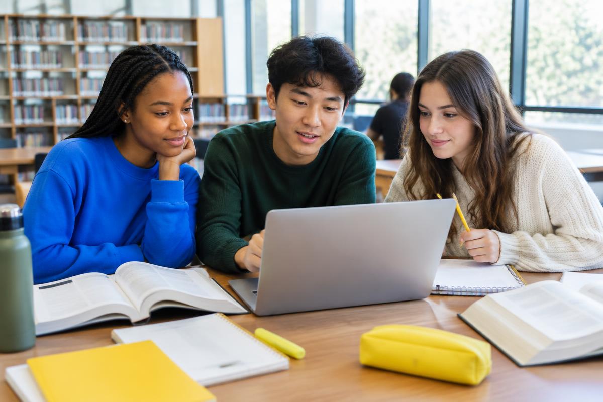 University students studying together at a library table